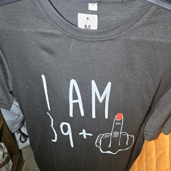 Tops - Black Graphic T-Shirt with Bold Statement
